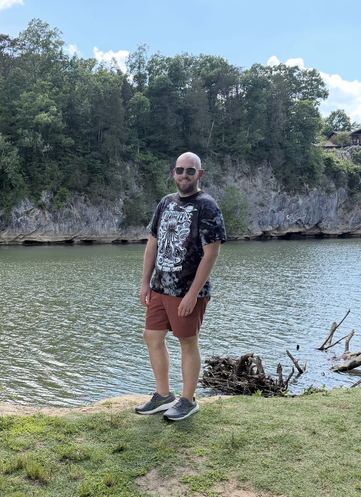 Jon, host of Exploration Unknown, at a scenic lakeside location